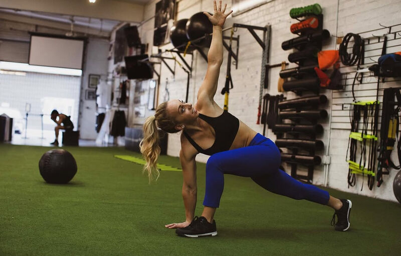 Katy guiding a stretch session in the studio